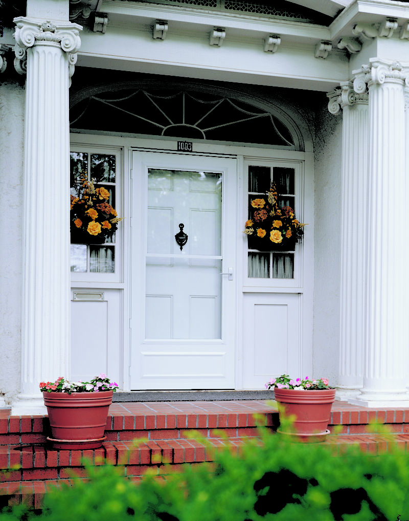 Exterior white entry door with storm door